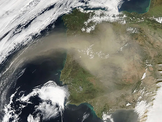 A NASA satellite image of a massive cloud of dust blown from the Sahara Desert over Spain