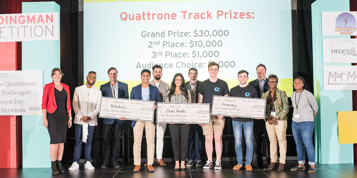 Ryan Downing and Bryan Houlton (4th and 5th from right) on the stage with the other winners of the Pitch Dingman competition.