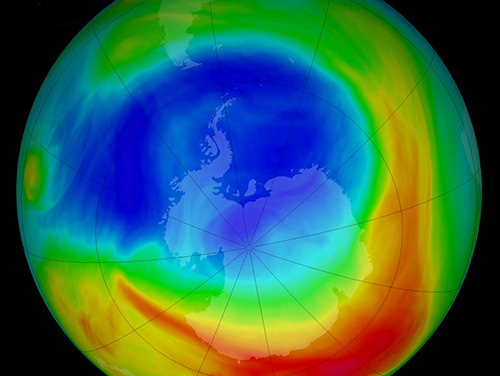 A rainbow color-coded rendering of Earth showing the hole in the ozone layer as of 2019. Credit: NASA.
