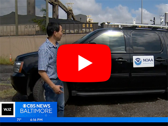 A video still from a news secgment showing Xinrong Ren with the National Oceanic Atmospheric Administration Air Resources Car. Credit: WJZ CBS Baltimore.
