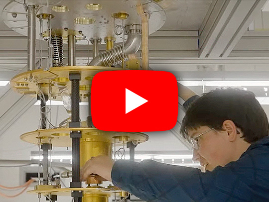 Video still of a student working on building a quantum computing device