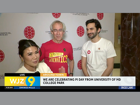 A screen capture of a news segment from UMD's Kirwan Hall, wherestudents, faculty and staff were celebrating Pi Day.