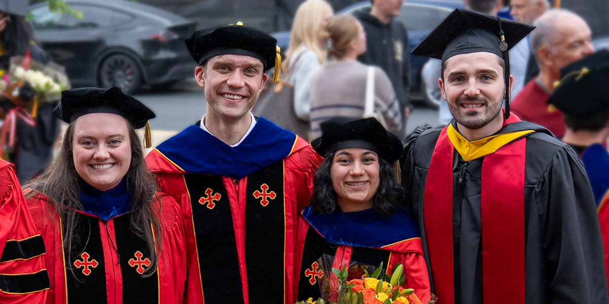 A photo of the M Circle, a hill with a giant M made out of red flowers, on a sunny day.