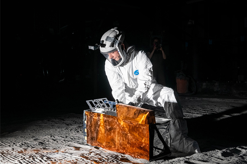 A scientist in the Exolith lab, a simulated mood environment used for testing the deployment of equipment.