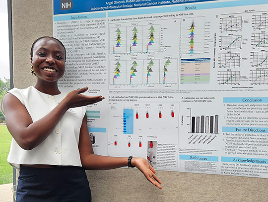 Angel Obiorah with one of her research posters. Angel Obiorah with one of her research posters.