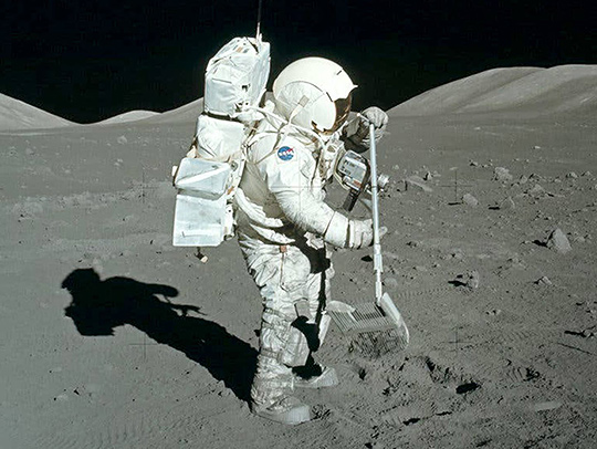 Apollo 17 astronaut Harrison Schmitt collects rocks on the final manned moon mission in 1972. Photo courtesy of NASA.