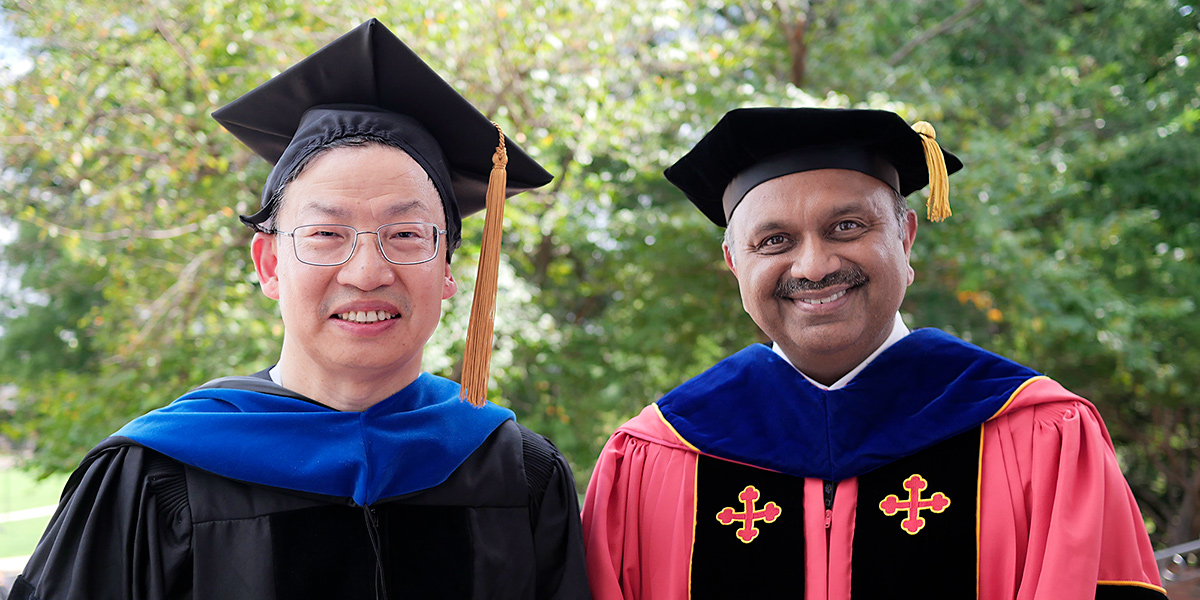 (L-R) Professor Lai-Xi Wang and Dean Amitabh Varshney wearing academic regalia at the 2023 Convocation ceremony