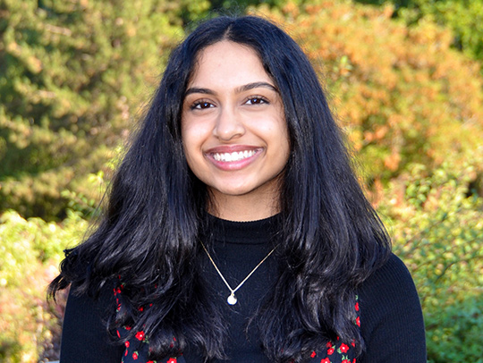 Bhavika Buddi, a young woman with long, black hair.