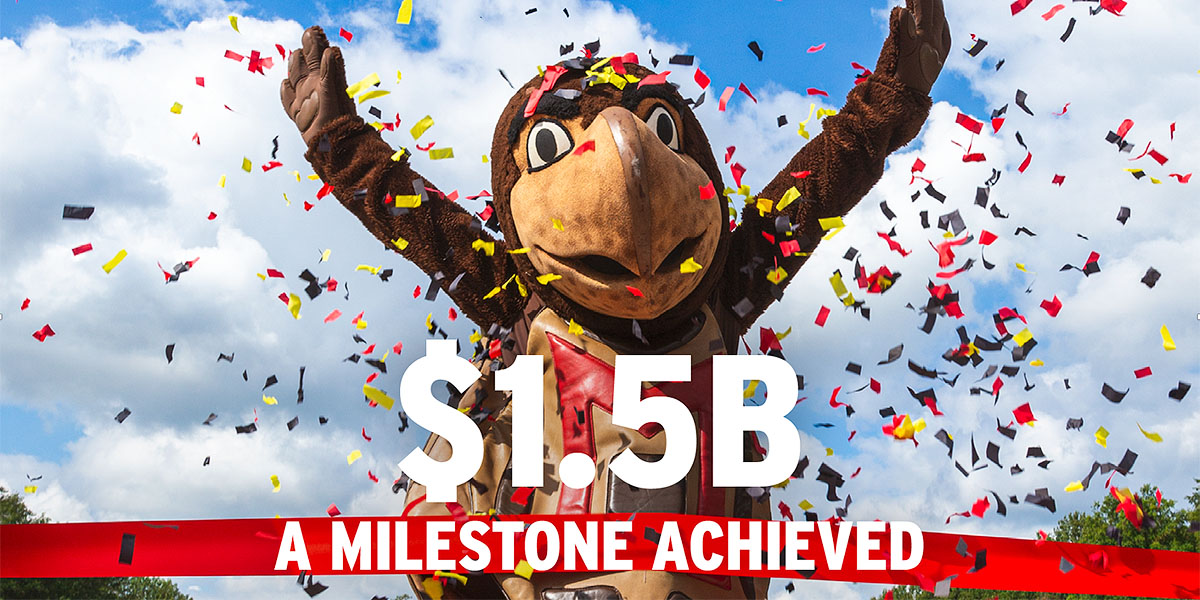 Testudo jumping and waving his arms while multicolor confetti falls around him. The words $1.5B - A milestone Achieved are overlaid.