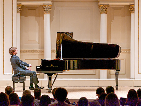 Jacob Goldman playing piano at Carnegie Hall