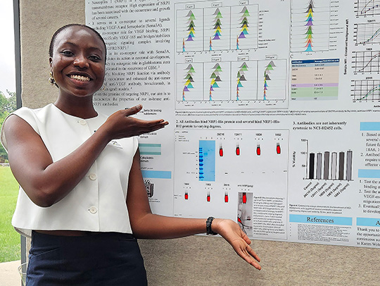 Angel Obiorah presenting a research poster