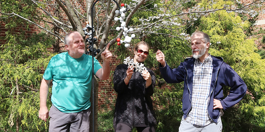 (L-R) Jeffery Davis, Andrea Ottesen and Paul Paukstelis collaborate on their Chemistry in Our Garden project.