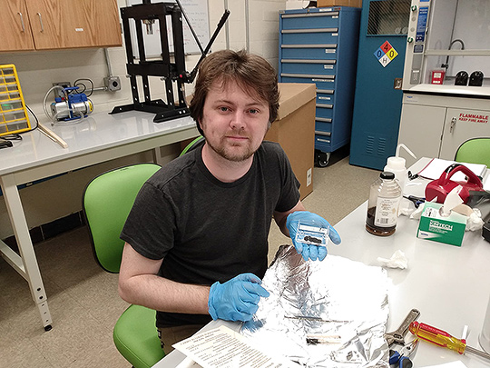 Cosmo Sykes in the laboratory. Credit: Megan Newcombe.