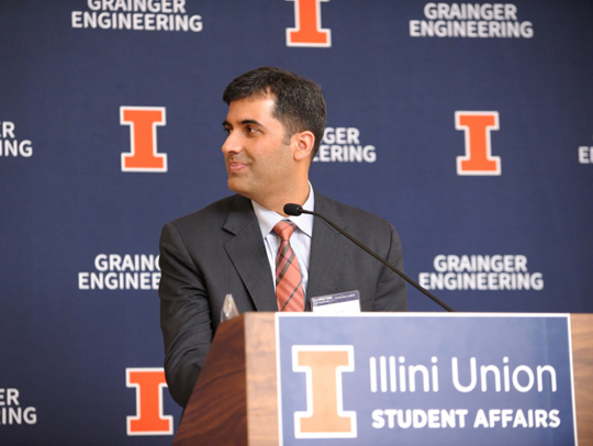 Abhinav Bhatele at a podium in front of a University of Illinois backdrop