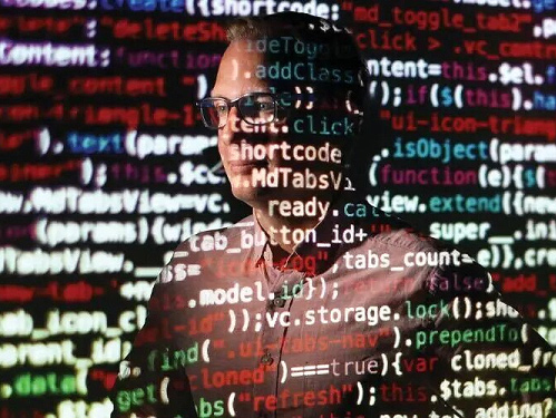 A conceptual photo composite of a man surrounded and covered by code.