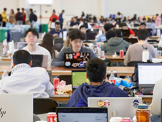 Students working on laptops at Bitcamp 2026