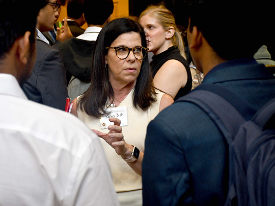 Karen Belt, a representative from Marriott International, talks with UMD CS students at the career fair.