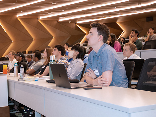 Students watch a presentation at CS's annual Research Day