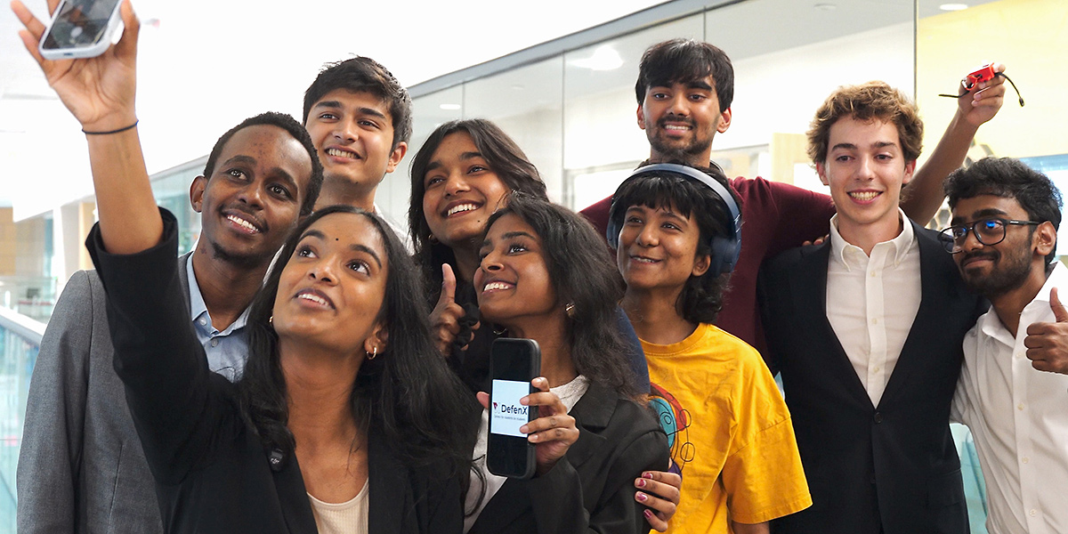 The DefenX team taking a group selfie