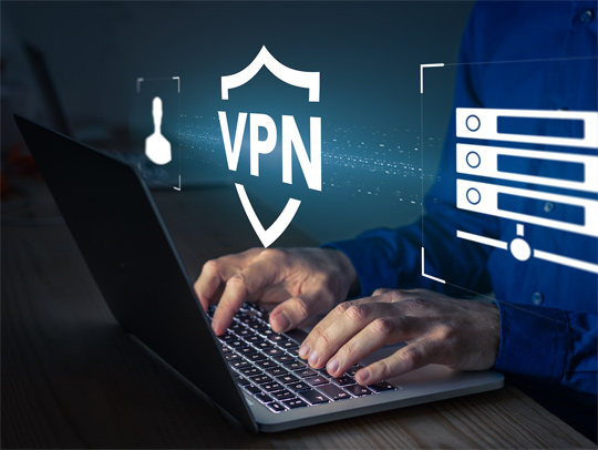 Stock art of hands at a computer and a shield-like VPN logo