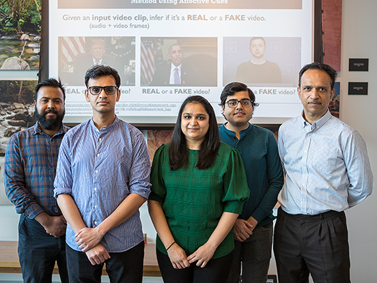 Dinesh Manocha (far right) with his research group
