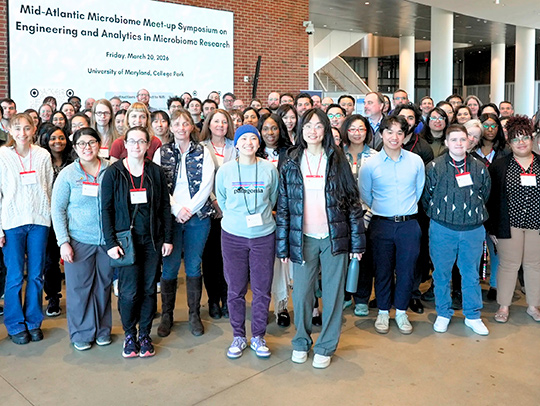 A large group of people in the Iribe Center lobby