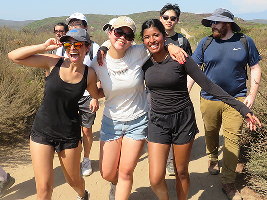 The Maryland Robotics team on a hike in California on a sunny day. Three young women are font and center, smiling and with their arms around each other. The Maryland Robotics team on a hike in California on a sunny day. Three young women are font and center, smiling and with their arms around each other.