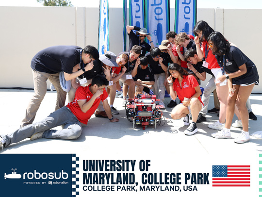 A group photo of the UMD RoboSub team gathered around their robot.