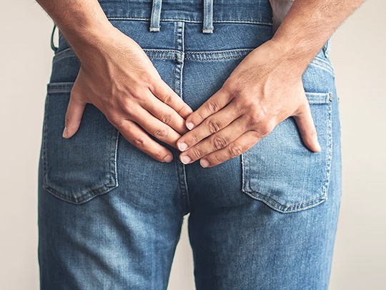 A cropped photo of hands covering the butt of someone wearing jeans. Credit: Busra Ispir-Getty Images