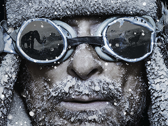 Crop of a movie poster. A man wearing battered goggles has an ice-crusted beard. His google have reflections of extinct animals in them. Credit: Tangled Bank and Handful of Films Crop of a movie poster. A man wearing battered goggles has an ice-crusted beard. His google have reflections of extinct animals in them. Credit: Tangled Bank and Handful of Films