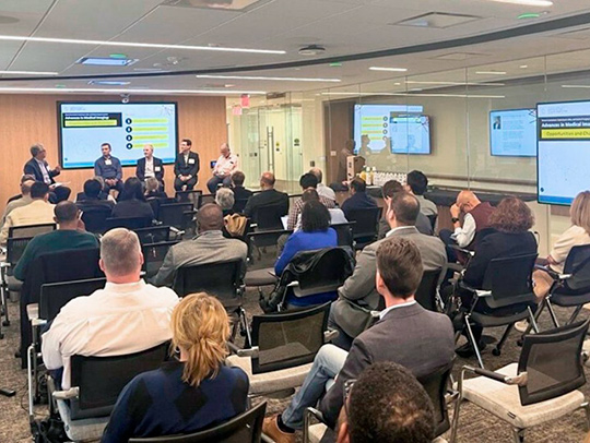 Attendees in a high-tech meeting room. Credit: Montgomery County Economic Development Corporation