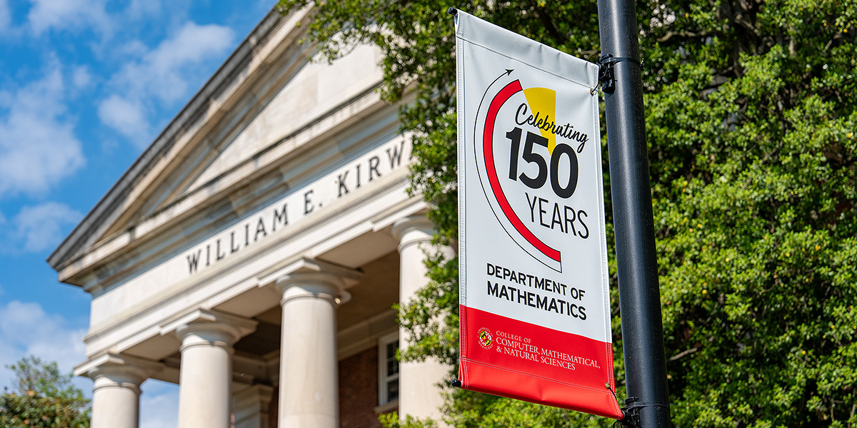 A 150th Anniversary banner on a lampost outside of Kirwan Hall, Home of Mathematics at UMD. Credit: Mark Sherwood