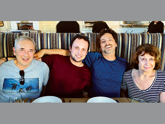 The Brin Family sitting on a couch. Eugenia Brin is on the far right.