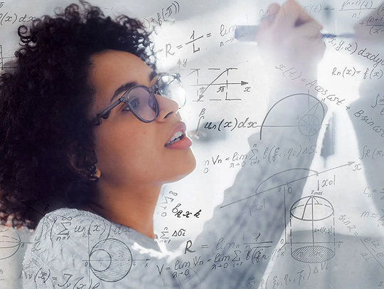 Closeup of a young woman writing math equations on a whiteboard. Credit: Adobe Stock.