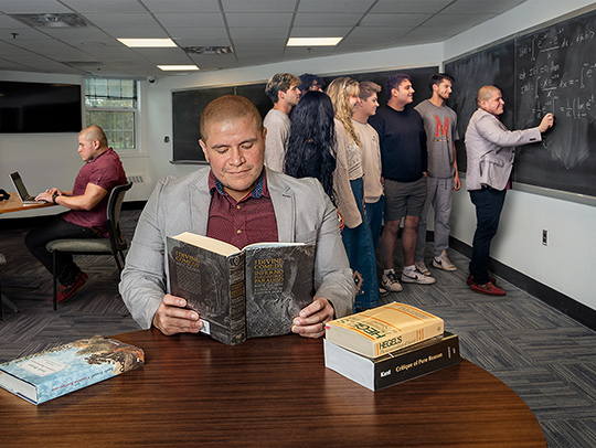 A composite photo of Luis Suarez doing different things in the same room: working on his laptop, reading a book, and teaching math at a blackboard with a group of students. Credit: Mark Sherwood.