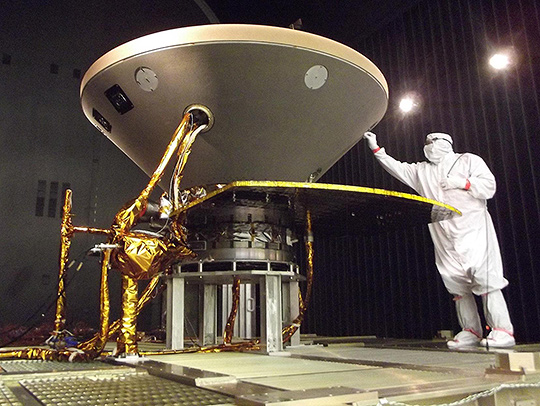 The Insight Spacecrapft being prepared by someone in a clean suit. Credit: NASA-JPL-Caltech_Lockheed Martin.
