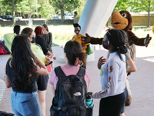 A group of atudents chatting with Testudo at the New Student Welcome Reception event. Photo credit: Faye Levine
