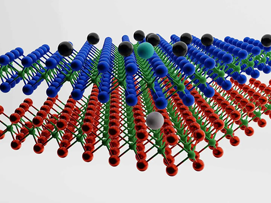 A 3D rendering showing a hole (grey sphere) residing in the bottom layer of a stacked material and paired to an electron in the top layer (cyan sphere). None of the electrons present in the top layer (black spheres) are willing to share a spot in the material with each other or the electron in the exciton. (Credit: Mahmoud Jalali Mehrabad-JQI)