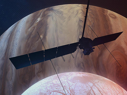 A 3D illustration of NASA's Europa Clipper spacecraft silhouetted against Jupiter. Credit: NASA-JPL-Caltech.