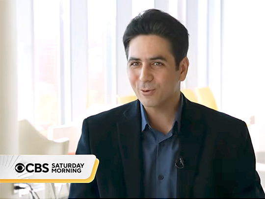 A still from a CBS news segment featuring Soheil Feizi. The CBS Saturday Morning show logo is in the lower left corner.