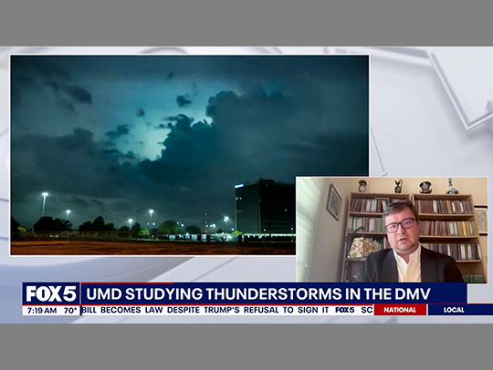 A still from a video showing William Miller talking about thunderstorms in a picture-in-picture with a larger video of a storm with lightning