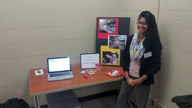 Shruti Ramachandra, Senior, major, Psychology, presents the team's lesson "Oil Spill Simulation," Ori Gutin (partner), Junior, major, Environmental Science & Policy, not shown