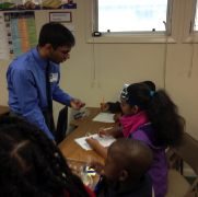 Kush Mukerjee performing the lesson, “Weathering-Chemical” at Hyattsville Elementary School. 